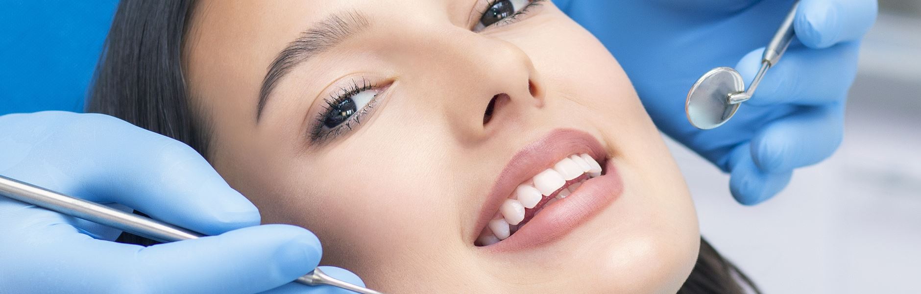 A beautiful woman is smiling after tooth whitening