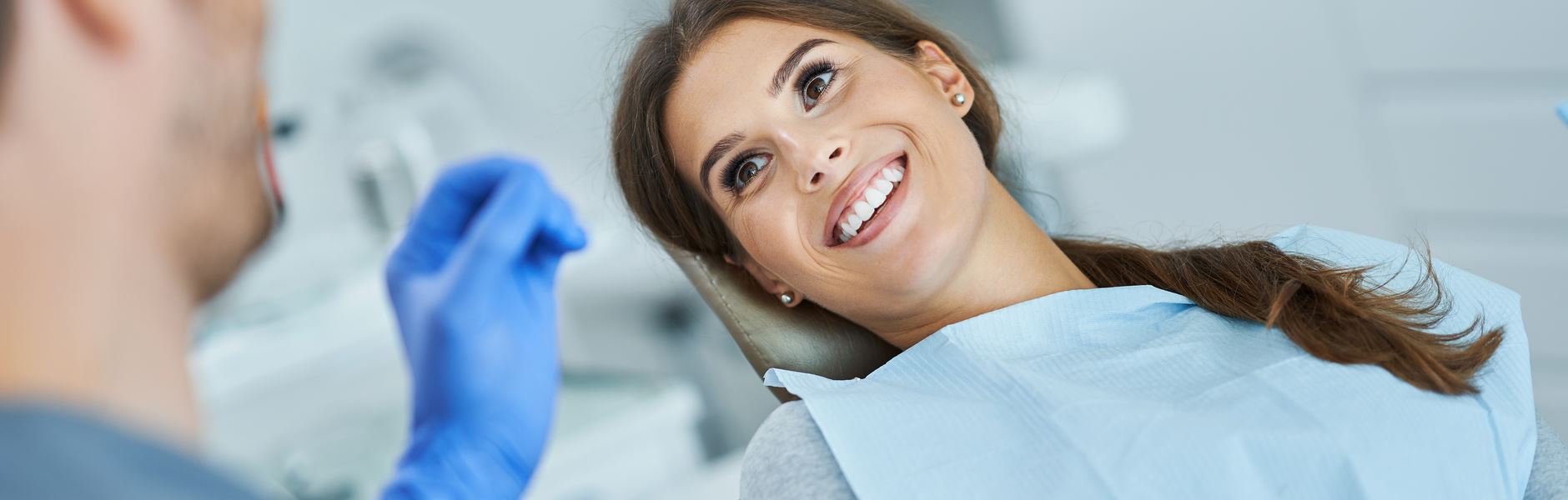 A beautiful woman is smiling after Tooth-colored Fillings